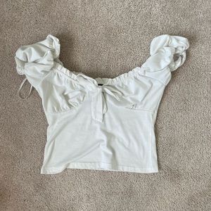 White top, on or off shoulder, bow in middle